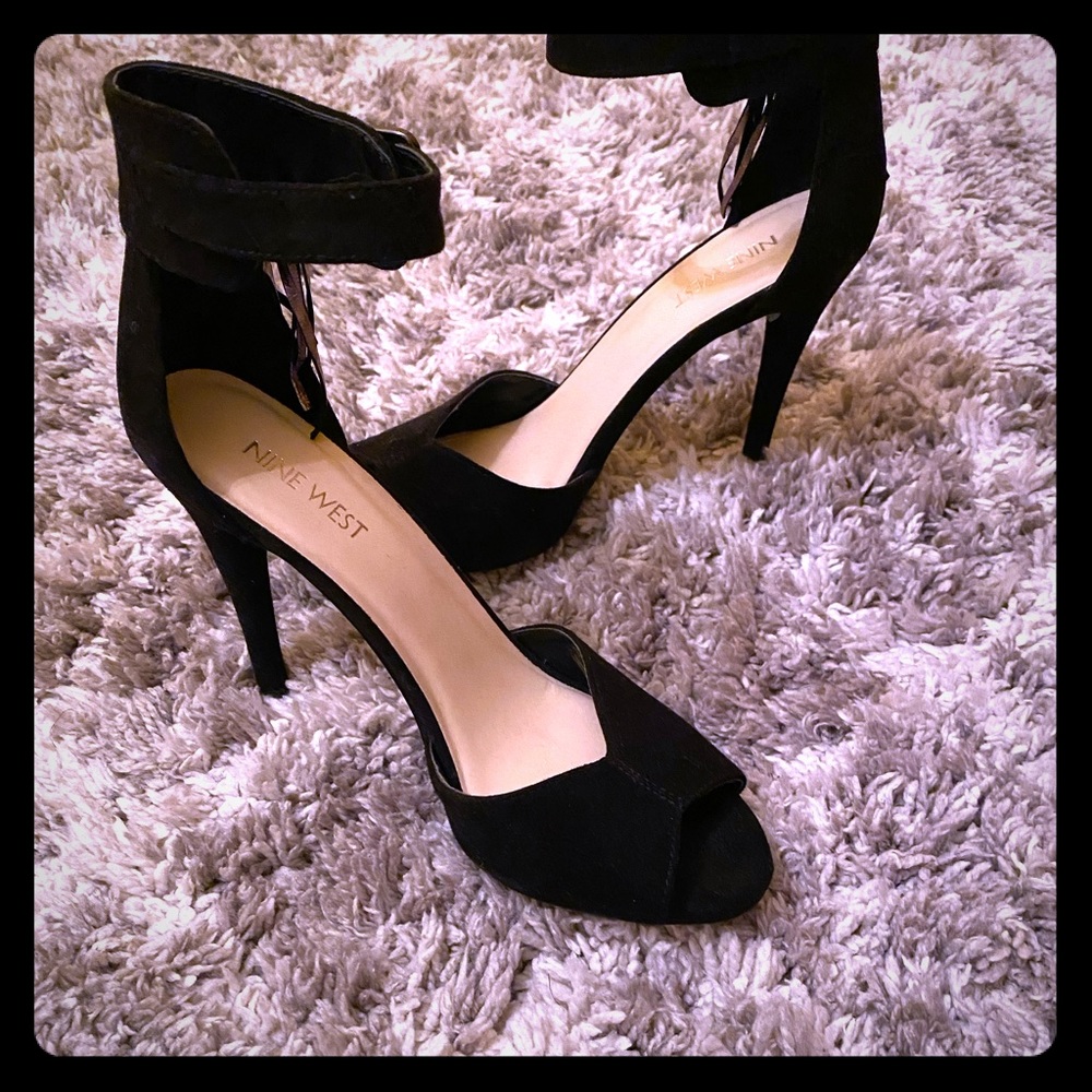 Black suede peep toe heels.